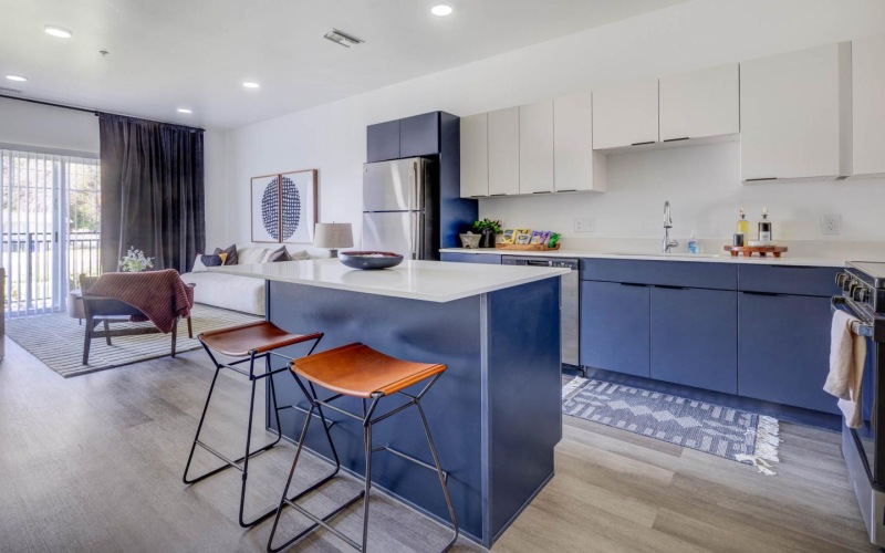 a kitchen with blue cabinets